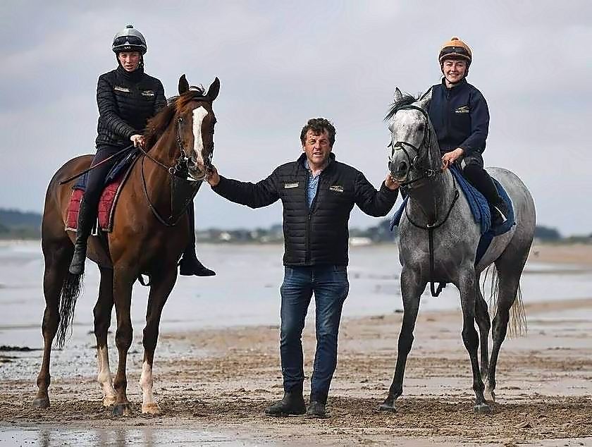 Trainer Ado McGuinness with jockeys on the beach